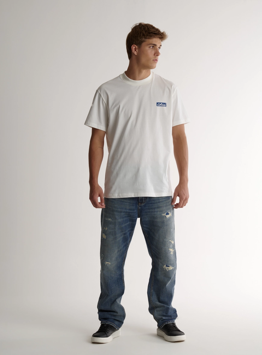 Calça Jeans Com Rasgos E Puídos